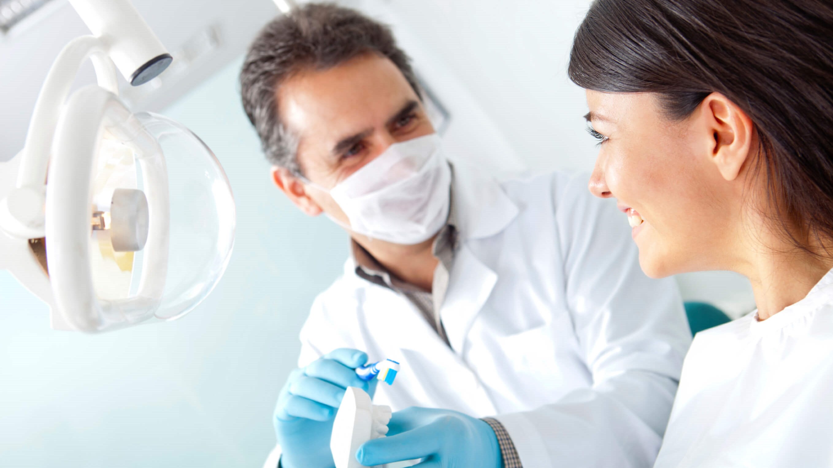 dentist seeing female patient